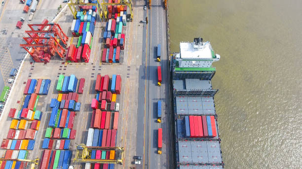 istock Logistics and transportation of Container Cargo ship and Cargo working crane bridge in shipyard 864557666