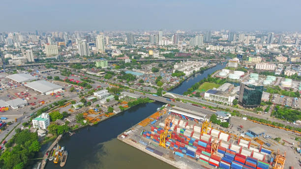 istock Logistics and transportation of Container Cargo ship and Cargo working crane bridge in shipyard 864557682