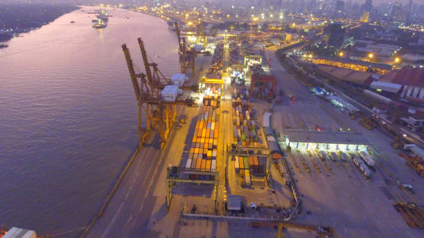 istock Logistics and transportation of Container Cargo ship and Cargo working crane bridge in shipyard 864558098