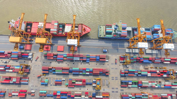 istock Logistics and transportation of Container Cargo ship and Cargo working crane bridge in shipyard 864558130