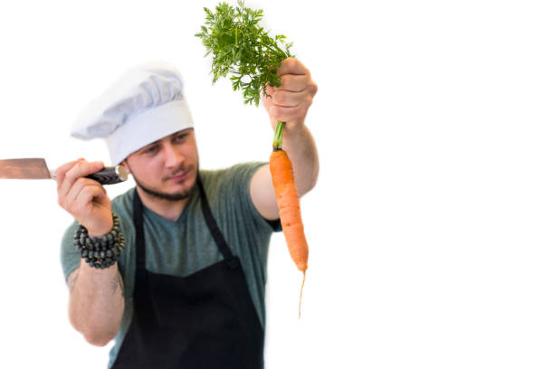 Chef preparing to cut the carrot