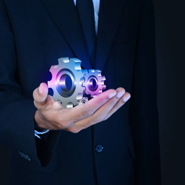 istock businessman showing gears cogs to success concept 864559228