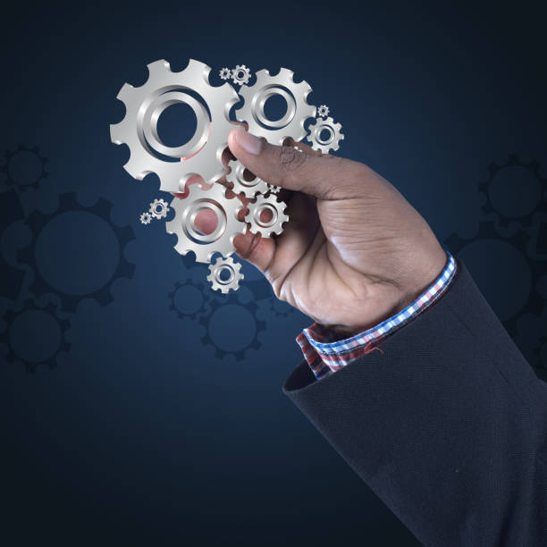istock businessman showing gears cogs to success concept 864566228