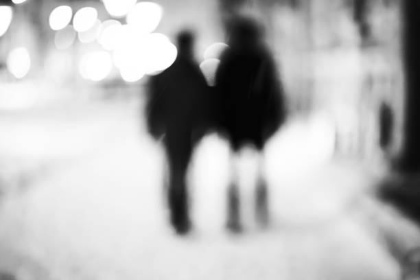 istock Silhouettes of two friends 864567018