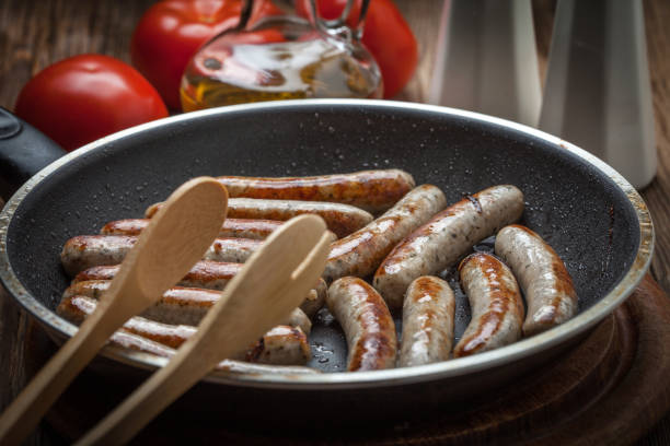 istock Fried white sausages in a cast iron skillet. 864568450