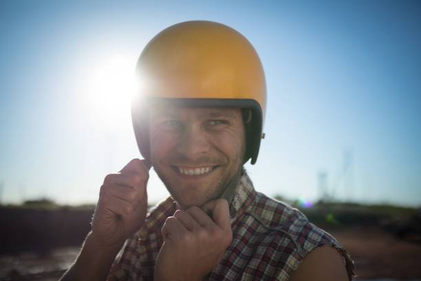 istock Man wearing a helmet on a sunny day 864570204