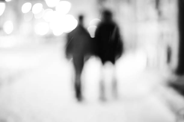 istock Silhouettes of two friends 864571120