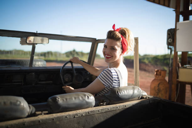 istock Woman sitting in car on a sunny day 864572354