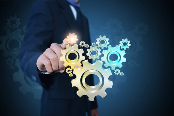 istock businessman showing gears cogs to success concept 864574468