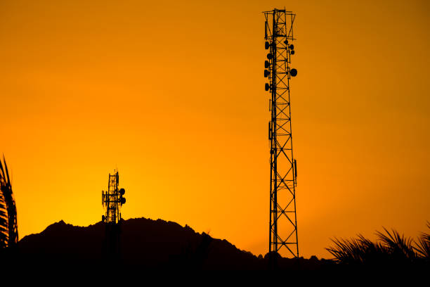 istock Silhouette of telecommunication tower with sunset sky 864574718