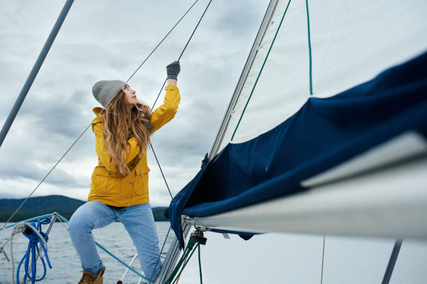 istock Young strong woman sailing the boat 864578106