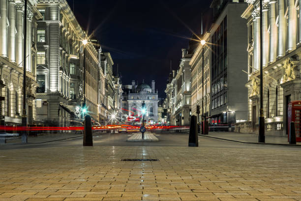 istock Light trails in Piccadilly Circus in London at night 864578292