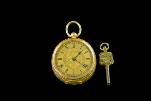 istock Antique Pocket Watch Gold & Key  Isolated on Black background 864579144