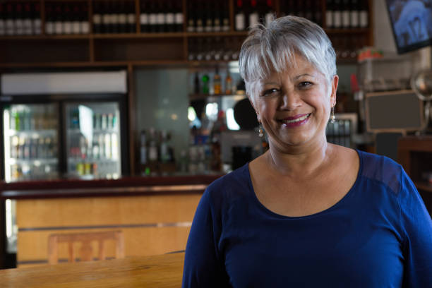 istock Portrait of waitress smiling 864579788