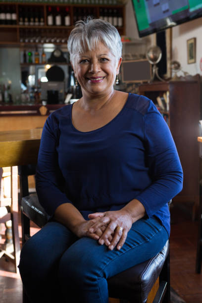 istock Portrait of waitress smiling 864579824