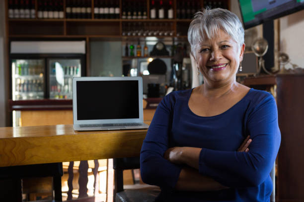 istock Portrait of waitress smiling 864579854
