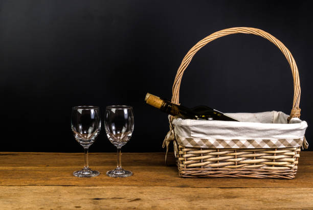 istock red wine bottles on wicker basket on wooden table 864581294