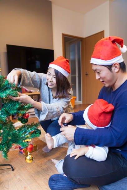 Japanese Family Decorating Christmas Tree