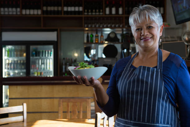 istock Waitress holding food bowl 864582016
