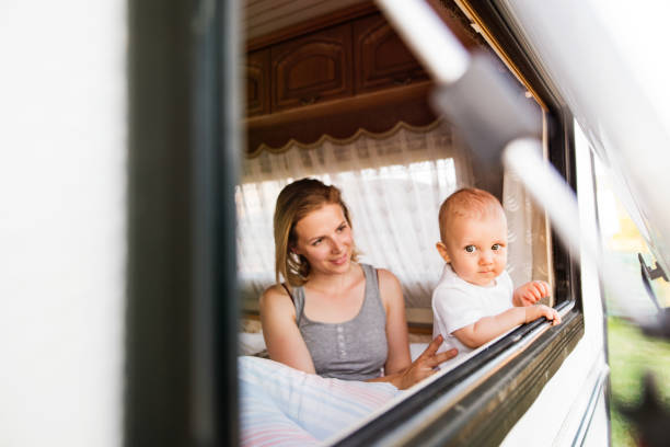 istock Mother and baby son in a camper van. 864582034