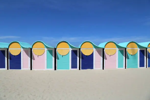 Colored beach cabins on Dunkirk beach in France