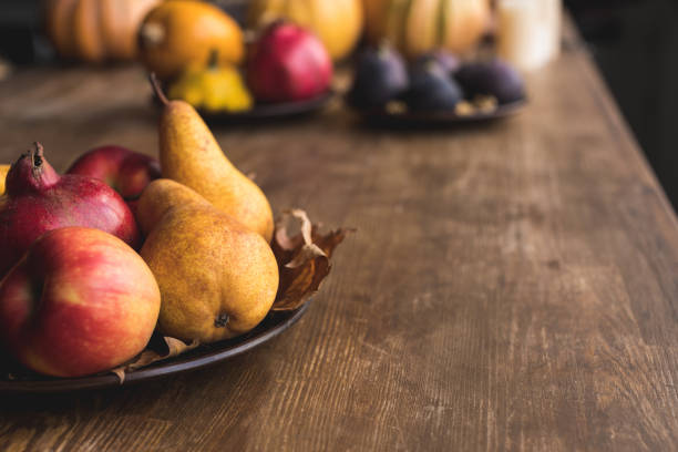 istock ripe autumn fruits on table 864582402