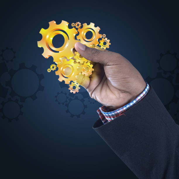 istock businessman showing gears cogs to success concept 864583008