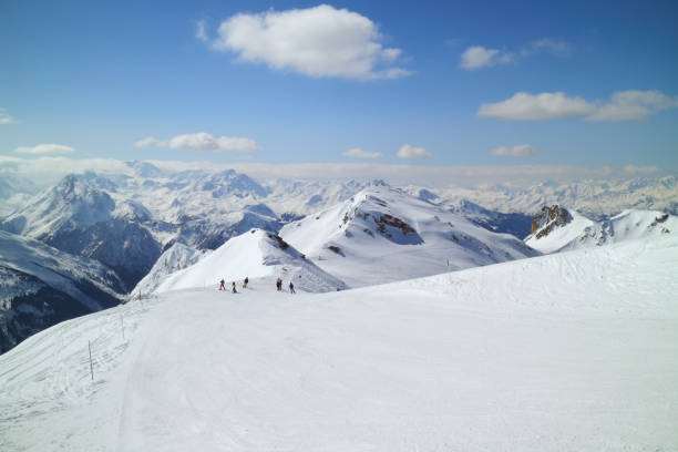 Skiing piste on top of alpine mountain, La Plagne, France Snowy slops in high Alps on a sunny winter day. la plagne photos stock pictures, royalty-free photos & images