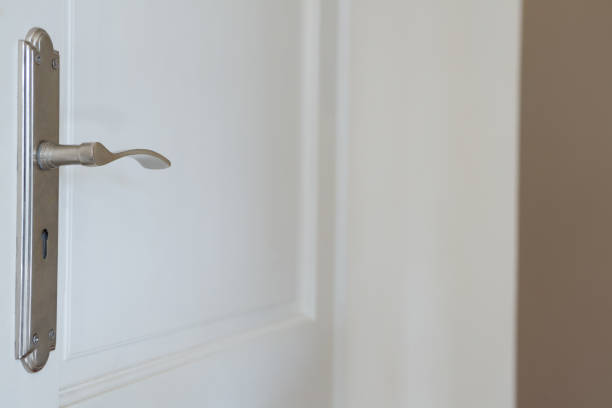 istock Exterior door handle and security lock on metal frame 864586020