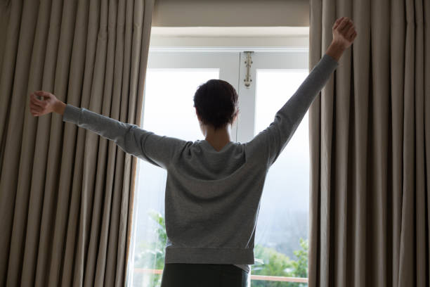 istock Woman stretching after wake-up in bedroom 864586890