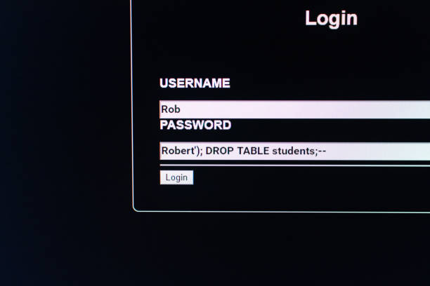 An unsafe website login window with data fields filled for a SQL Injection. The password field is compiled to execute after the INSERT the DROP of the entire table "main" stock photo