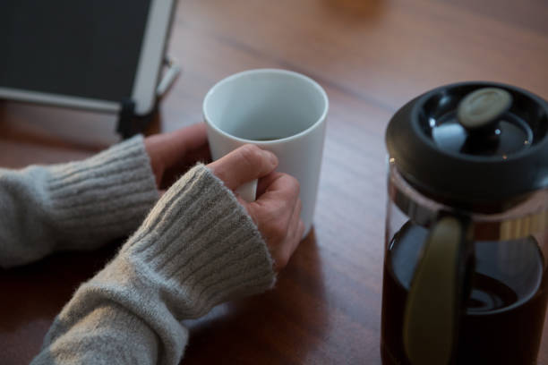 istock Woman having cup of coffee at home 864587762