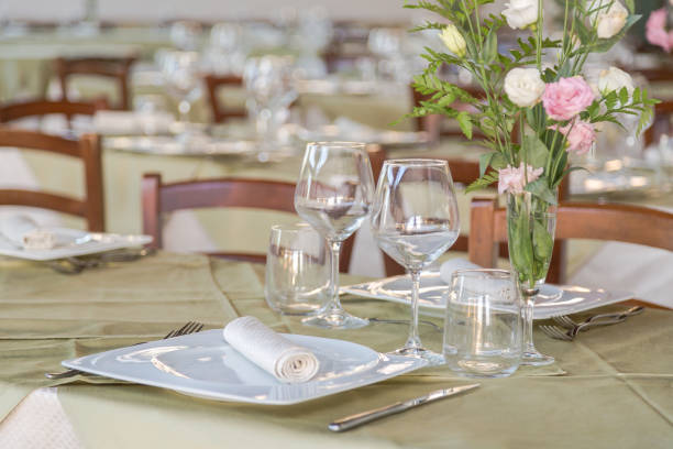 istock Elegant table set with cutlery, plates and glasses. 864588492