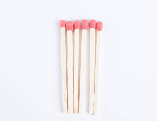 istock High angle view of matches on white background. 864591066