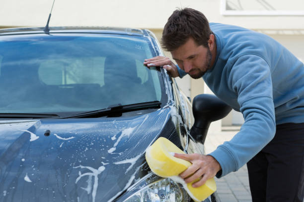 istock Auto service staff washing a car with sponge 864591494