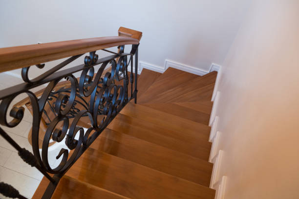 istock Interior wooden stairs with metal railing 864592774