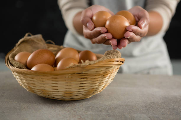 istock Woman holding brown eggs 864595506