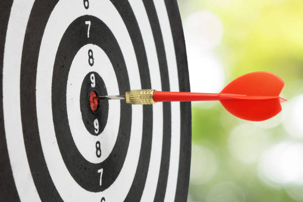 istock Target dart and arrow with abstract nature bokeh blur background. 864596054