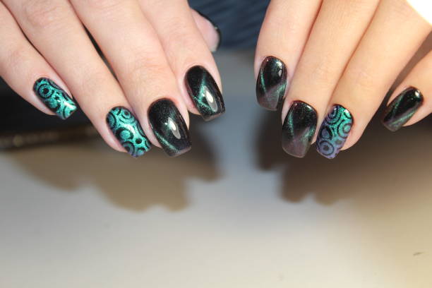 istock Color cat's eye manicure with a nail polish 864597658