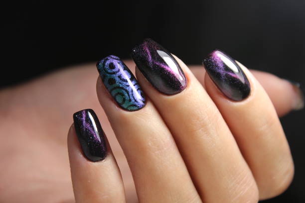 istock Color cat's eye manicure with a nail polish 864598094