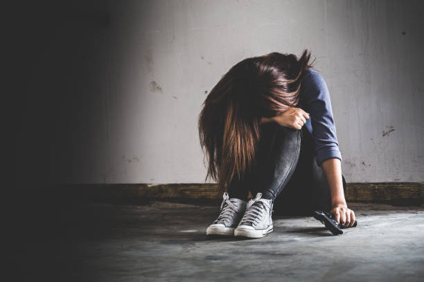 istock Sad women who are thinking about suicide committed by guns. 864598906