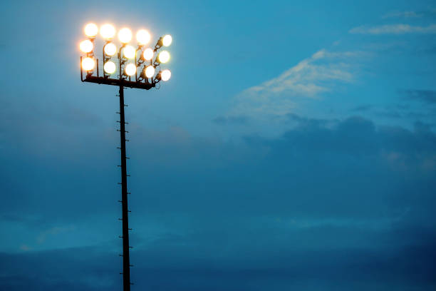 istock Sports stadium lights at dusk, night. 864599668