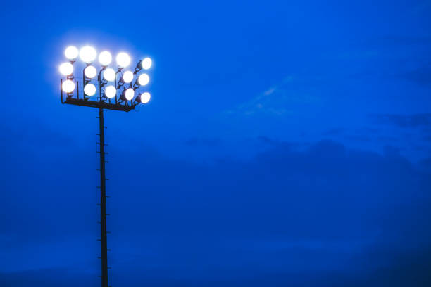 istock Sports stadium lights at dusk, night. 864600560