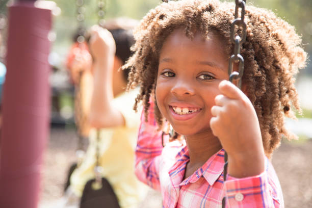 istock Multi-ethnic group of school children playing on school playground. 864607860