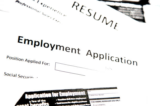 istock Job fair table with employment applications, resumes. 864618700