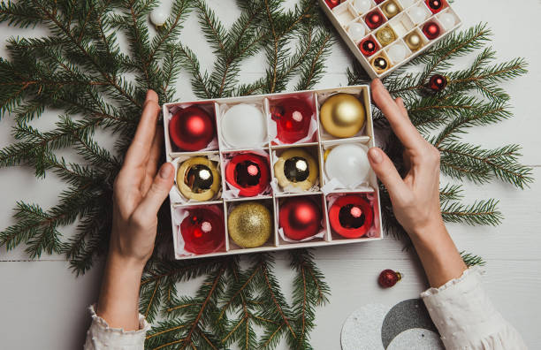istock Christmas decoration from above overhead with woman hands 864629172