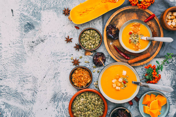 istock Homemade Autumn Butternut Squash Soup. Flat lay. Copy space 864629642