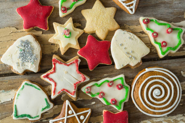 istock Gingerbread cookies arranged on wooden plank 864630530