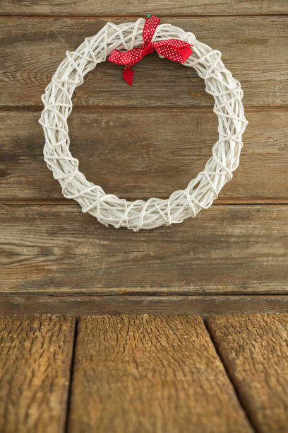 istock Christmas wreath on wooden surface 864637390