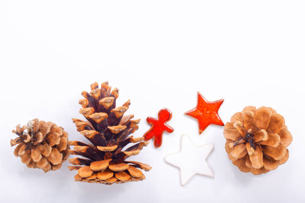 istock Background Christmas and New year Concept Pine cones and nuts with ceramic decoration  on white background 864643718